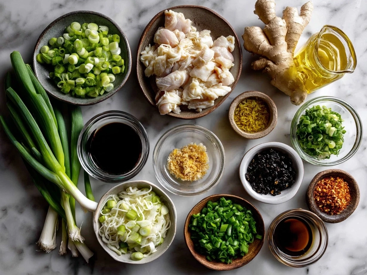 Ingredients for Ginger Scallion Chicken Noodle Soup including ginger, scallions, chicken breasts, noodles, and broth